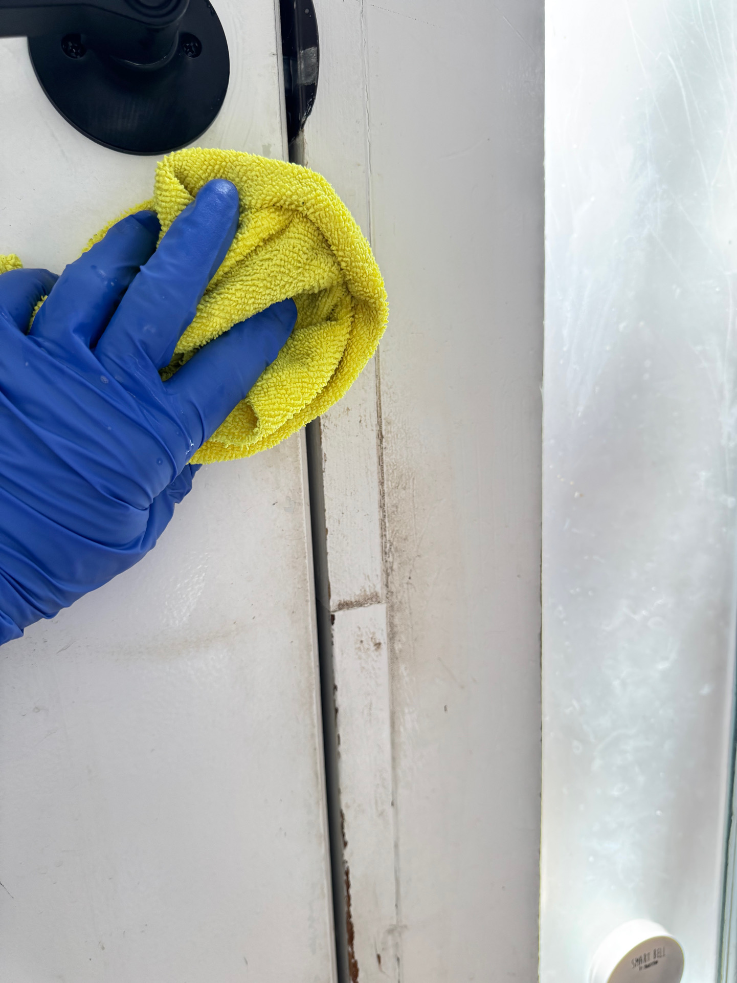 Door frame being detail cleaned